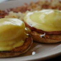 Eggs Benedict · Toasted English muffin, potatoes Canadian bacon, poached eggs, and hollandaise sauce.
