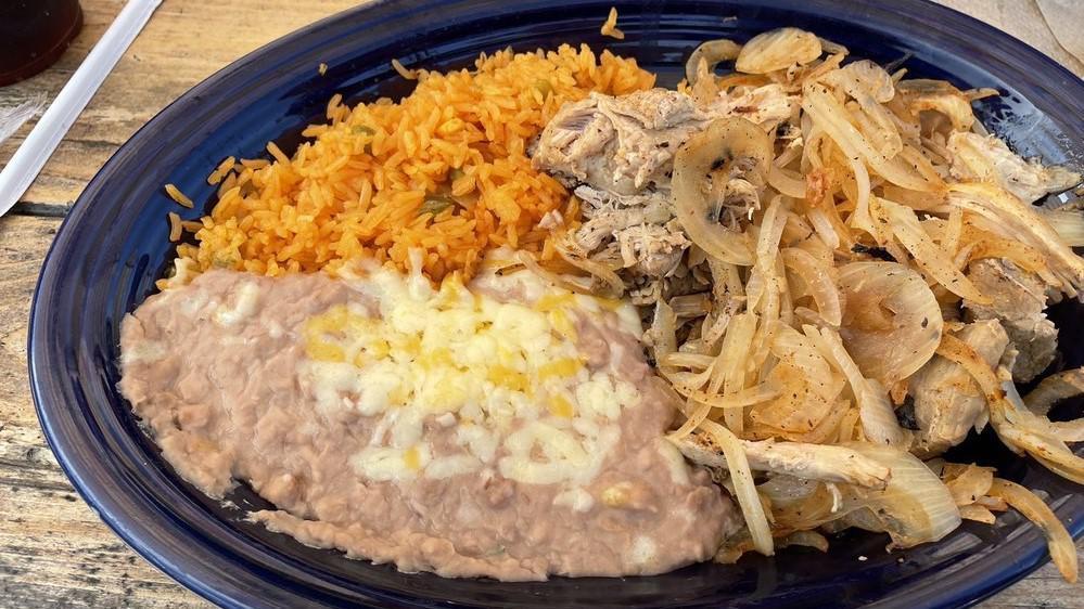 Carnitas · Tender chunks of roasted pork and grilled onions served with Mexican rice, refried beans, guacamole salad, pico de gallo and tortillas.