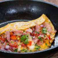 Western Omlette Combo · Three eggs scrambled with onions, green peppers, and diced ham