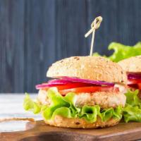 Turkey Burger · Homemade Turkey Burger served on a potato roll with lettuce and tomato.