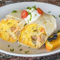 Sunrise Burrito · 3 eggs scrambled with sausage, tomatoes, onions, homefries, and cheddar cheese in a wrap