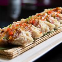 Crazy Lady Roll · Deep-fried spicy salmon kani, cilantro, cream cheese, avocado, wrapped soybean paper, eel sa...