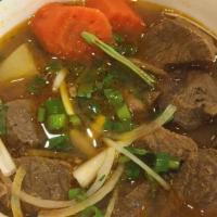 Spicy Beef Noodle Soup · Favorite. Spicy. Bun bo hue. Served with bean sprout, cilantro, basil, lime, and jalapeño.