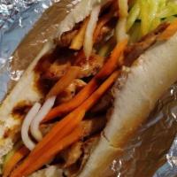 Grilled Pork Hoagie · Banh mi thit nuong. Served with cucumber, lettuce, pickle, and jalapeño.