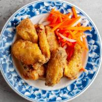 Chicken Wings · Canh ga chien. Deep-fried and tossed in a homemade sweet chili sauce.