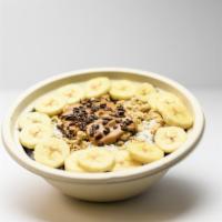 Acai Bowl · Blended acai, banana, and almond milk topped with fresh banana, peanut butter, granola, coco...