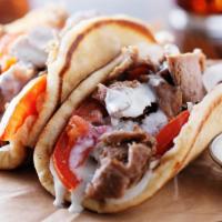 Ny Style Gyro In Pita Bread · Made with fresh homemade sauce and marinated meat.