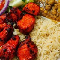 Spicy Boneless Chicken Kabob · Spicy. Served with fresh basmati rice, chickpeas, salad, fresh baked bread and green sauce. ...