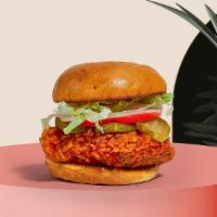 Crispy Cluckin' Schnitzel · Crispy chicken, sweet chili mayo, lime, American cheese and iceberg lettuce served on a brio...