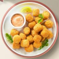 Talking Tater Tots · (Vegetarian) Shredded Idaho potatoes formed into tots, battered, and fried until golden brow...