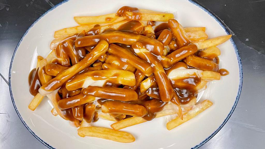 Disco Fries · Melted cheese over French fries and topped with brown gravy.