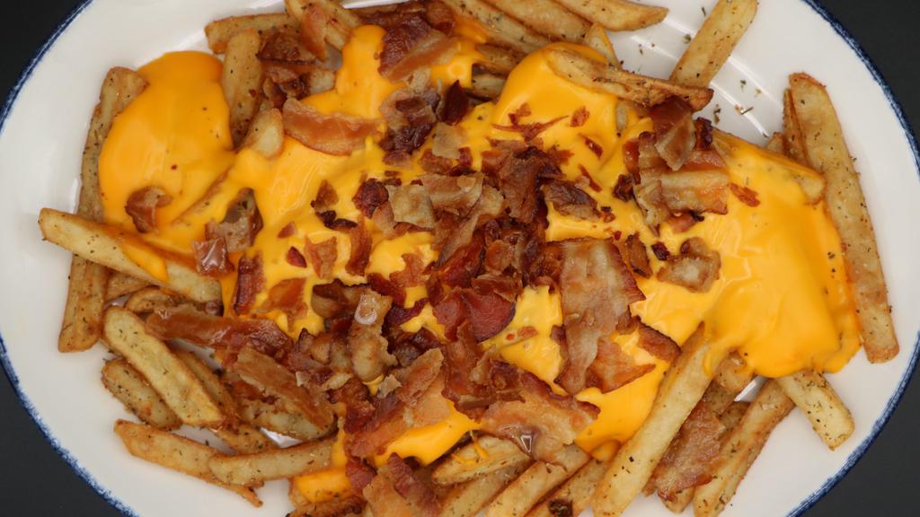 Loaded Fries · Loaded with bacon bits and melted Cheddar cheese.