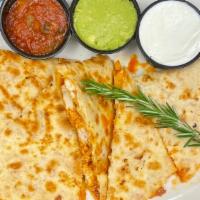 Chicken Quesadilla · Grilled flour tortilla stuffed with grilled chicken, Jack and Cheddar cheeses, and diced tom...