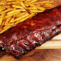 Baby Back Ribs Half Rack · Tender baby back ribs rubbed in BBQ sauce.Served with double French fries.