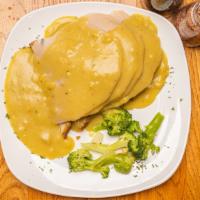 Roast Turkey · Young slow roasted turkey breast over stuffing and topped with turkey gravy. Served with two...
