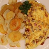 Meatlovers Omelette · Four-egg omelette with bacon, sausage, and ham.