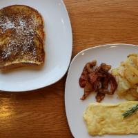 French Toast Deluxe Combo · Two big slices of homemade cinnamon French toast, two large eggs, your choice of breakfast m...