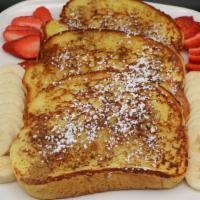 Cinnamon French Toast · Three big slices of our homemade, cinnamon battered French toast grilled golden brown and li...