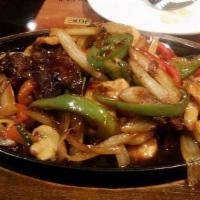 Mongolian Triple · Spicy. Sliced tender beef, chicken and jumbo shrimp with sliced bell pepper, onion, scallion...