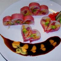 Nikko Roll · Tuna, salmon, yellowtail, avocado, cucumber, and flying fish roe wrapped in soybean paper.