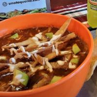Tortilla Soup · Delicious mixture of roasted tomato, pasilla chile and garlic, finished with, sour cream, ch...