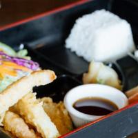 Deluxe Bento · Miso soup, salad, , tempura, gyoza, sashimi (5 pcs.), California roll (6pcs.).