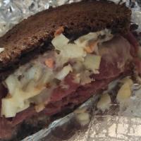 Reubenette · Corned beef, Swiss cheese & coleslaw with Russian dressing, grilled on dark rye.