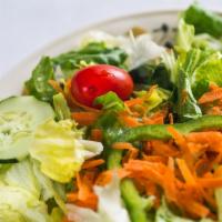 Garden Salad · Iceberg and romaine lettuce, carrots, cherry tomatoes, cucumbers and green pepper