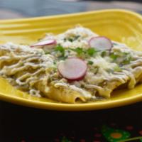 Enchiladas · Three soft corn tortillas rolled and stuffed with your choice of filling. Topped with green ...