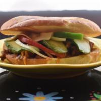 Torta · Mexican style sandwich stuffed with your choice of filling, refried beans, cheese, onion, pe...