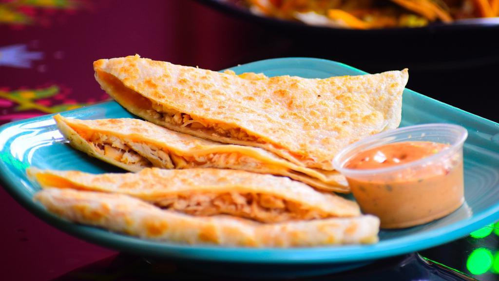 Quesadilla · Flour tortilla stuffed with cheese and your choice of filling. Folded and grilled to perfection. Served with chipotle aïoli sauce on the side.
