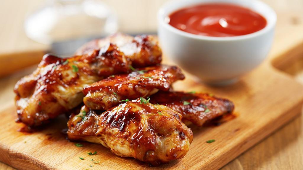 Honey Bbq Wings · Deep fried chicken wings tossed in a spicy sweet sauce. Comes with your choice of dipping sauce.