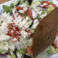Greek Salad · Lettuce, tomato, kalamata olives, feta, onions and Greek dressing.