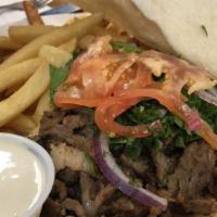 Beef Shawarma Platter · Choice of rice or French fries side hummus, pickles, a mix of parsley, onions, tomato's and ...