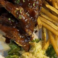 Half Rack Baby Back Ribs · Danish baby back ribs smothered in BBQ sauce served with french fries and cole slaw