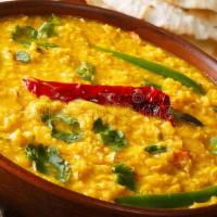 Daal Tadka (V) · Vegan, gluten-free. Yellow lentil tempered with Indian spices and tomatoes, Indian herbs and...