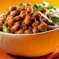 Panjabi Chole With Rice (V) · Vegan, gluten-free. Garbanzo beans simmered in a tomato-onion gravy and flavored with spices.