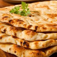 Garlic Naan · Made with all-purpose white flour. White flour bread with garlic baked in our tandoor.