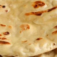 Tandoori Roti · Made with whole wheat flour. Whole wheat unleavened bread baked in our day oven.