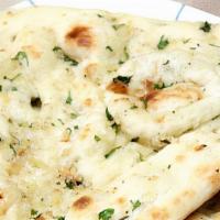 Garlic Chilly Naan · Spicy. Made with all-purpose white flour. White flour bread with garlic and chilly baked in ...