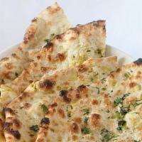 Onion Kulcha · Made with all-purpose white flour. Naan bread filled with lightly spiced onions.