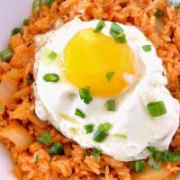 Kimchi Fried Rice · Spicy. Korean fermented cabbage stir-fry fried rice with sunny side up egg.