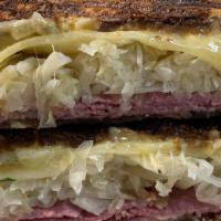 Reuben · Lean corned beef, Swiss cheese, sauerkraut, Russian dressing, marble rye bread.