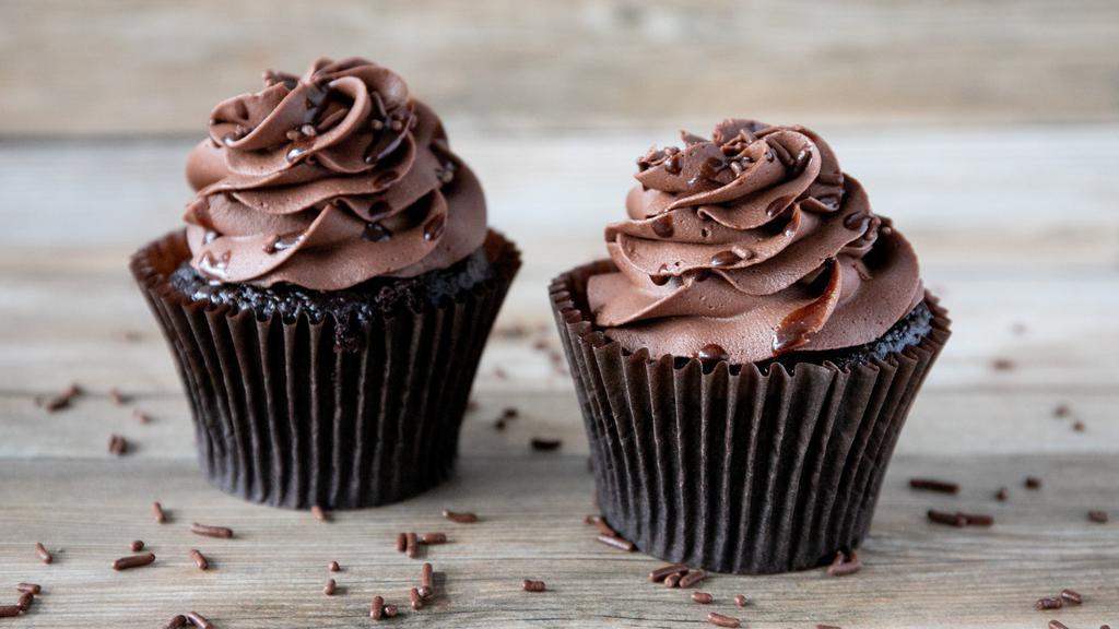 Death By Chocolate Cupcake · Chocolate cake with chocolate cream cheese frosting and chocolate sauce drizzle.
