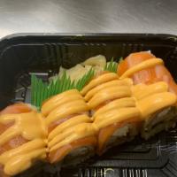 Sp19. Moon Roll · Grilled eel crab stick cream cheese cucumber inside, topped with salmon sashimi & spicy mayo