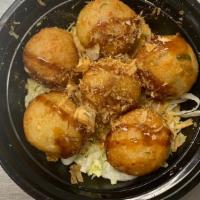 Takoyaki · Deep-fried octopus balls with eel sauce.