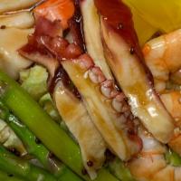 Seafood Salad · Cooked octopus, crab stick, steam shrimp, white tuna, asparagus, radish, mix with ponzu sauc...