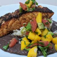 Cabo Salmon (Tuesday Only!) · Blackened salmon on black bean puree served with rice and mango relish.