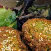 Falafel Platter · Authentic Egyptian falafel served over greens. Served with pita bread, hummus and tahini dri...