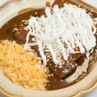 Enchiladas De Mole · Enchiladas with your choice of carnitas, pulled pork, chicken, or steak covered in our uniqu...